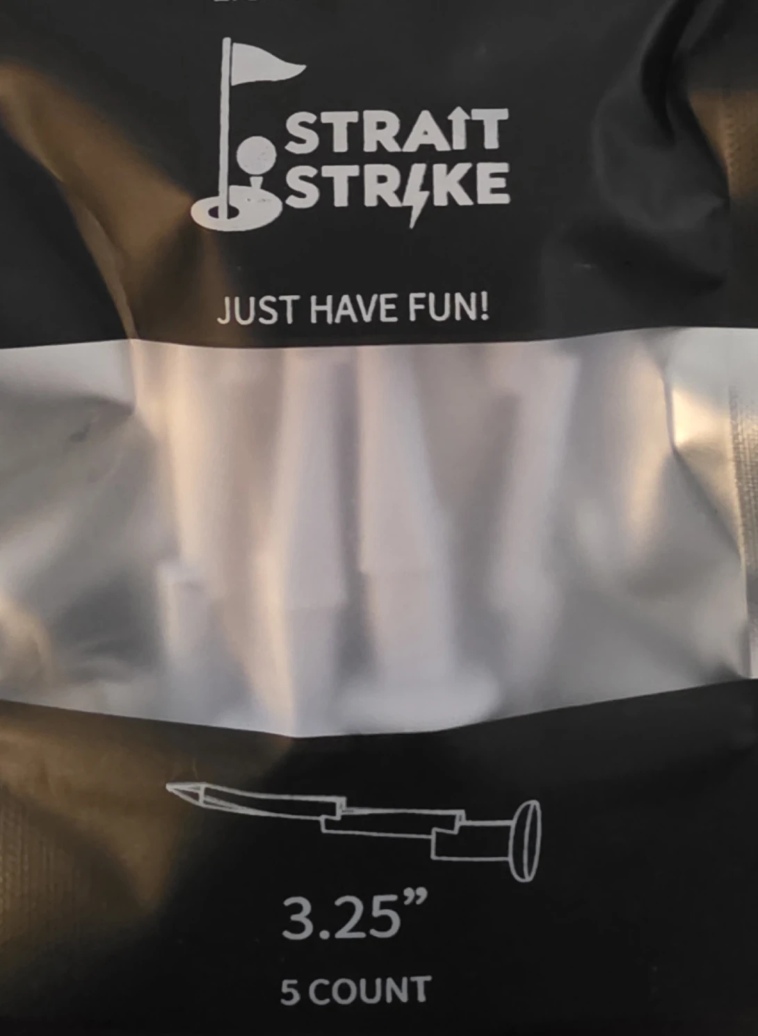 Close-up of a packaged tool labeled 'STRAIGHT STRIKE' with the phrase 'JUST HAVE FUN!'